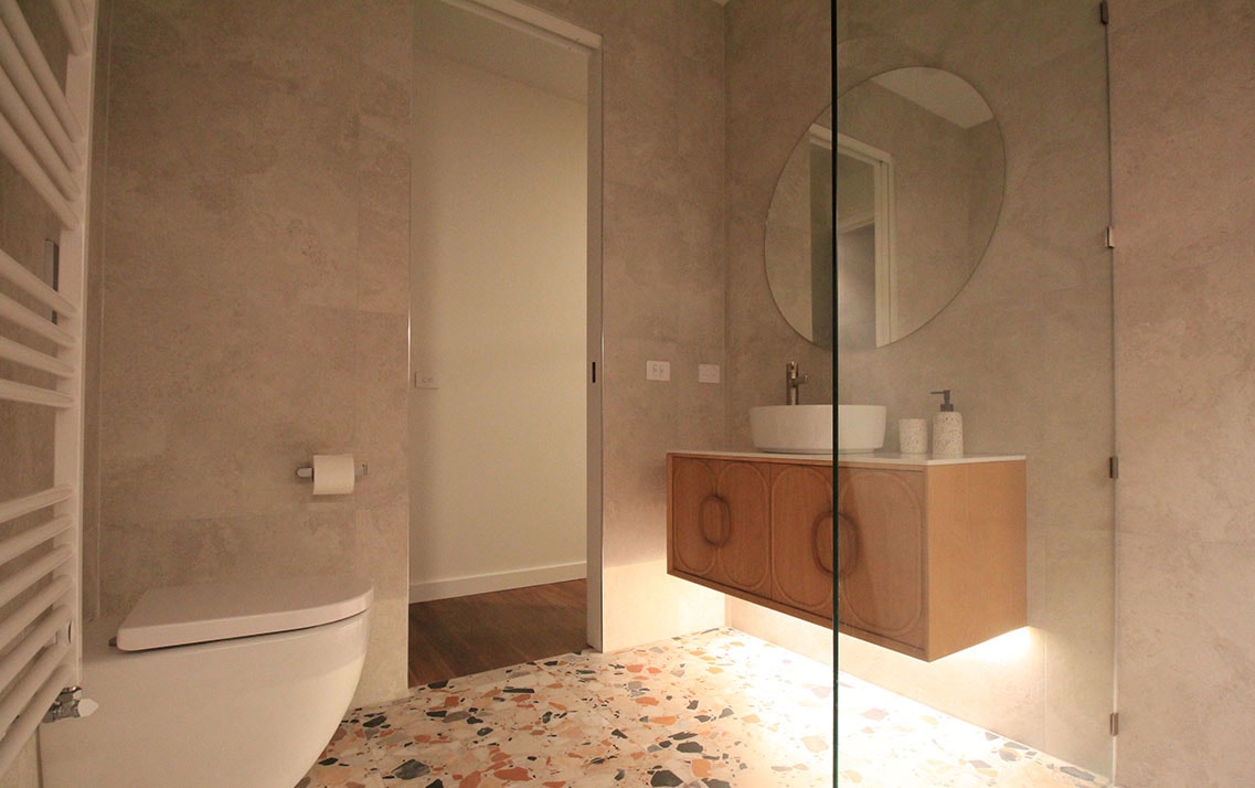 Walk-in shower with frameless glass enclosure